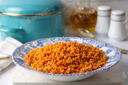 Preview: Traditional turkish bulgur pilaf with tomato sause in plate (Turkish name; meyhane pilavi)