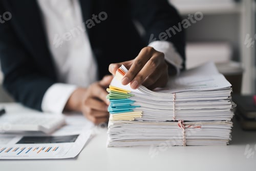 Preview: Cropped short of businesswoman working with stack of document, organizing the project in the office