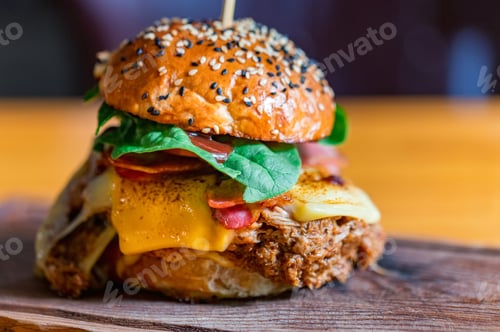 Preview: Close up tasty burger with minced meat served on tray
