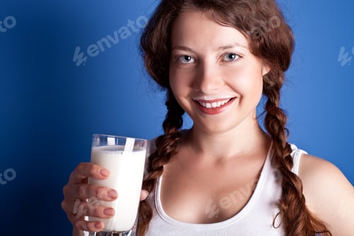 Preview: woman enjoying a glass milk