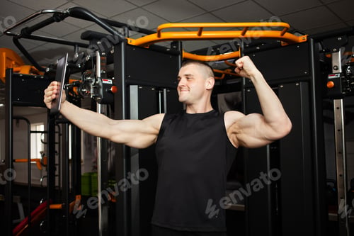 Preview: young handsome coach with a muscular body