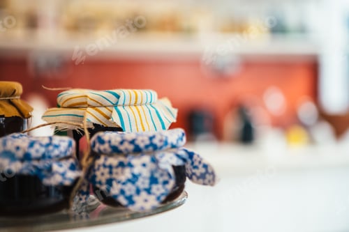 Preview: Close up of jam in jars on cakestand