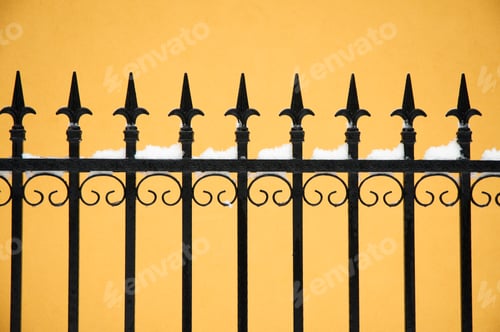 Preview: Snow on Black Decorative Fence with Yellow Background
