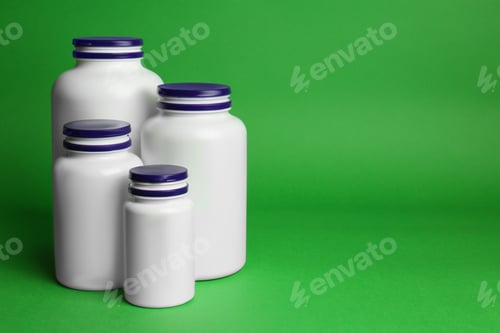 Preview: Many different plastic medicine bottles on green background, space for text. Medicament