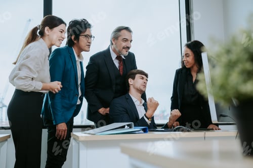 Preview: great results, group of young cheerful business people in casual wear working together on project