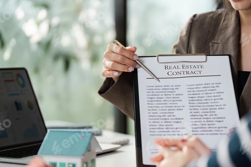 Preview: Real estate agent highlighting contract terms to client, showcasing