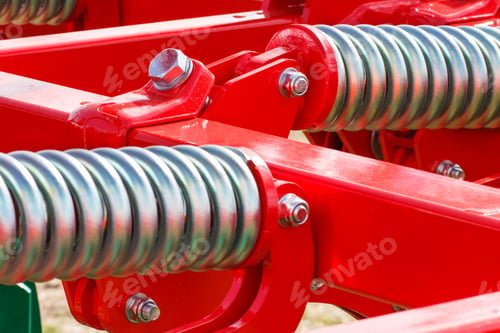 Preview: Hard silver spring made of steel. Part of big industrial or agricultural machine