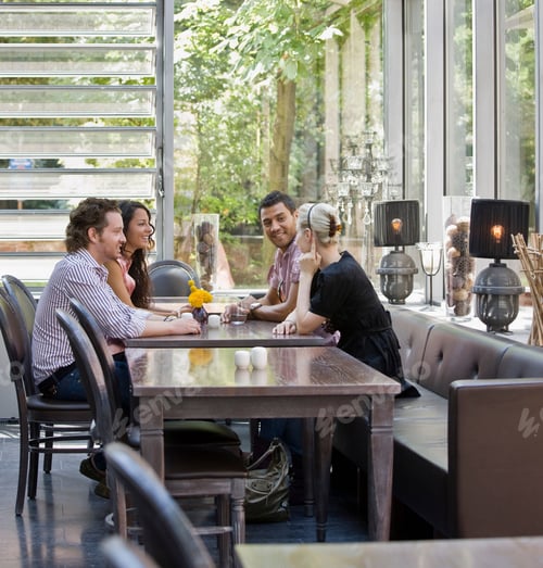 Preview: Men and women talking over drinks