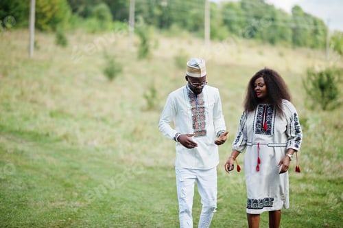 Preview: African couple in traditional clothes at park.