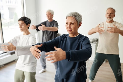 Preview: Group of Qigong Class Participants Practicing Tree Pose