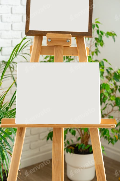 Preview: Blank canvases on easels set in a bright studio with indoor plants for creative artwork sessions