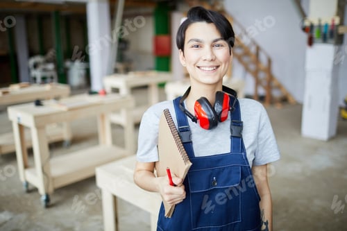 Preview: Young Fe,ale Worker Posing at Factory