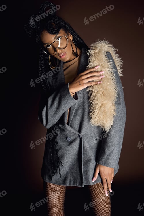 Preview: Stylish Woman Poses in Coat and Glasses