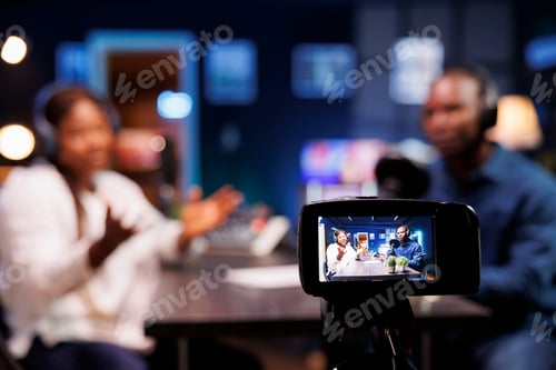 Preview: Device on a tripod filming a talk show