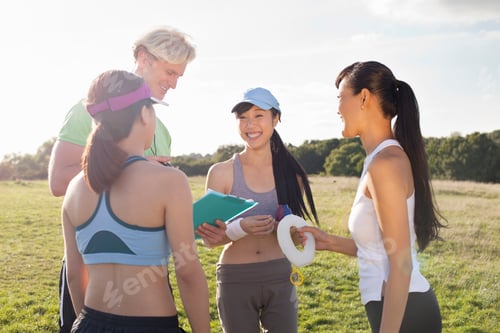 Preview: Personal trainer giving instruction to group of clients