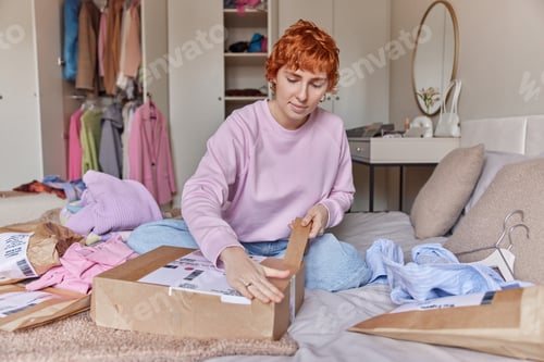 Preview: Young woman runs small business prepares parcel shipments works from home involved in online