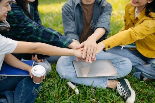 Preview: Young Asian college students and a female student group work at the campus park