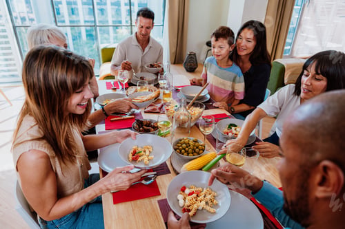 Preview: Family and friends reunion at home. Friends and family sharing a meal together at home