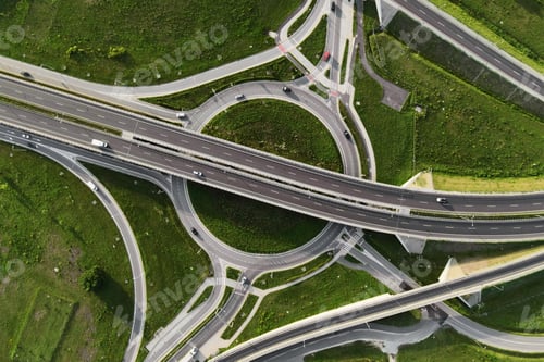 Preview: Cars moving on transport road junction in city, aerial view