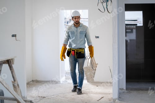 Preview: Electrician working working on building site, Repair and handyman concept.
