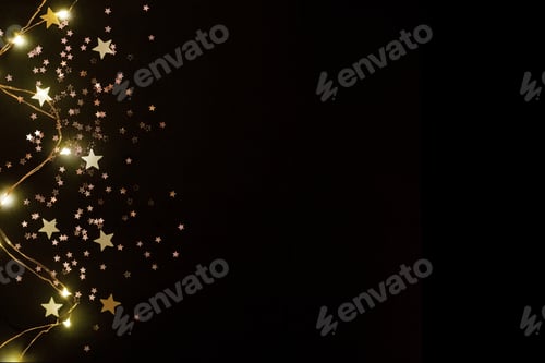 Preview: Christmas romantic lights frame on black background with copy space. Decorative garland in night spa