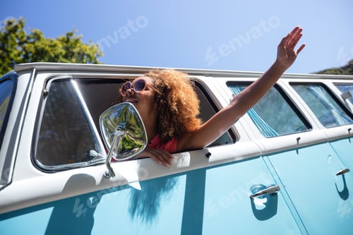 Preview: Woman looking out of camper van window