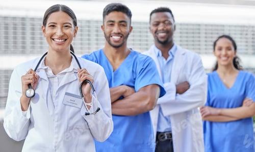 Preview: Were here to take care of you. Shot of a group of doctors standing against a city background.