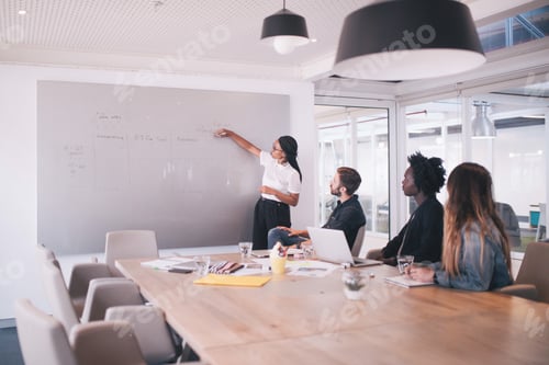 Preview: Group of young adult coworkers in meeting room