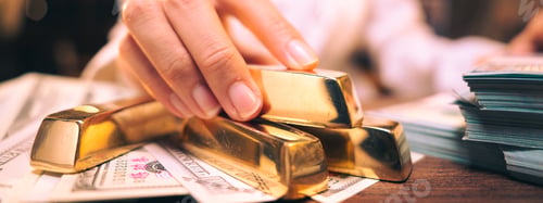 Preview: The hand holding the precious gold bar shows the success of the finance business