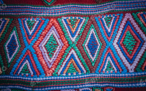 Preview: Vibrant, multi-hued rug with intricate geometric shapes and designs