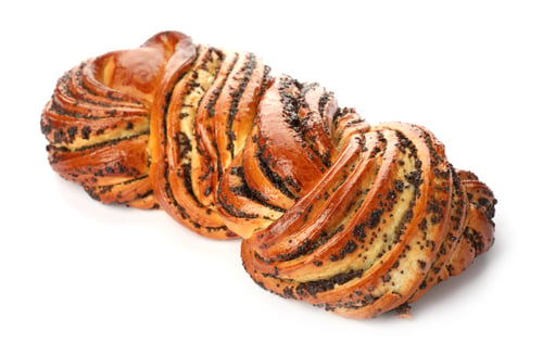 Preview: Tasty sweet bun with poppy seeds on white background