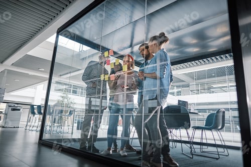 Preview: Diverse businesspeople having a brainstorming session in an office boardroom