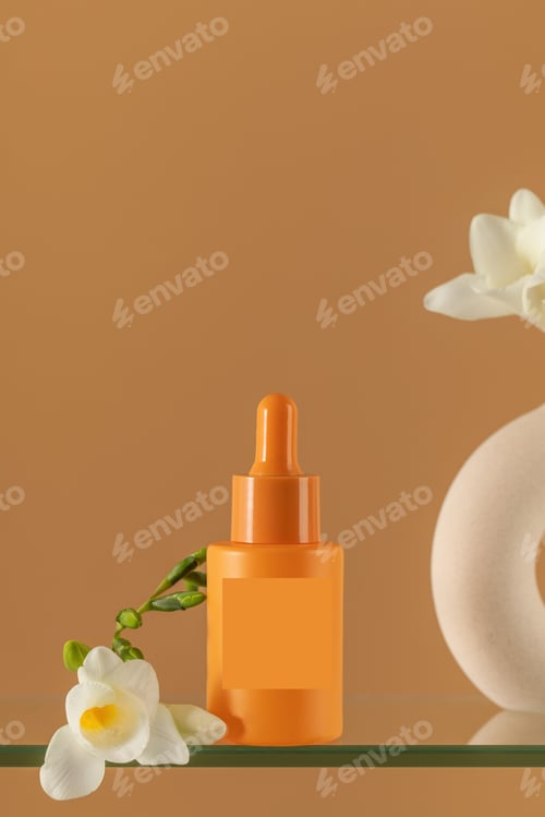 Preview: Enjoy the simplicity of a minimalist orange serum and floral vase. Skin care