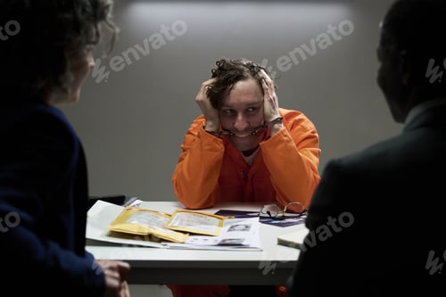 Preview: Interrogating Individual in Orange Jumpsuit Being Questioned