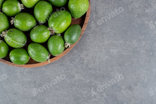 Preview: Fresh feijoa fruits on wooden plate