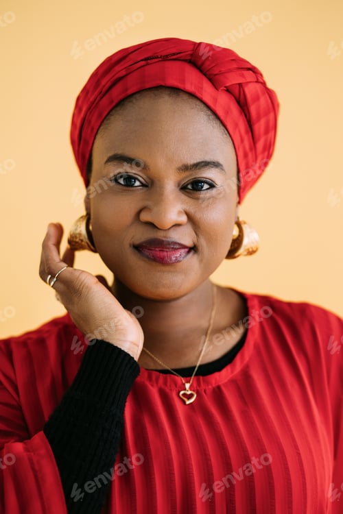 Preview: Beauty, ethnic people and fashion concept. African woman face portrait. Pretty smiling lady in red