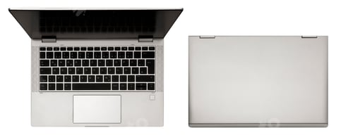 Preview: Modern light gray laptop with sleek design, isolated on white background. Top view.