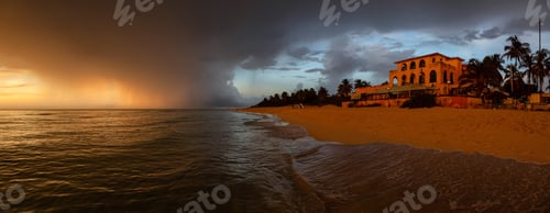 Preview: Vacation resort on the sandy beach during a dramatic cloudy sunset