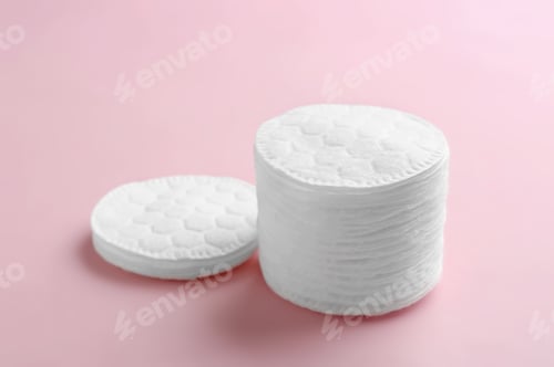 Preview: Cotton pads on color background. Space for text