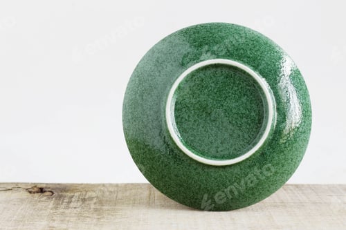 Preview: back of saucer on wooden