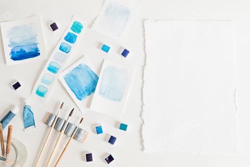 Preview: Artist painting watercolor palettes with brushes. Craft artistic background