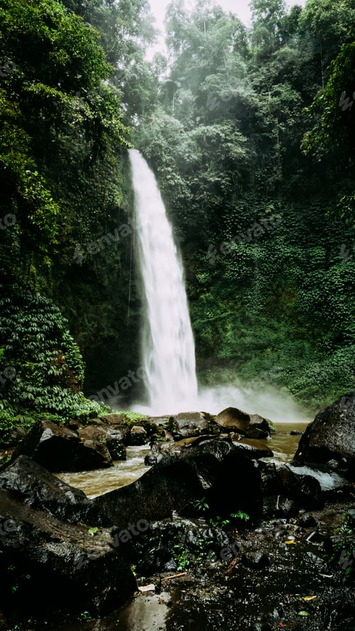 Preview: Nungnung waterfall on rainy day. Bali, Indonesia