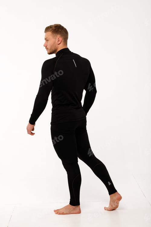 Preview: A man with a sporty physique in thermal underwear.
