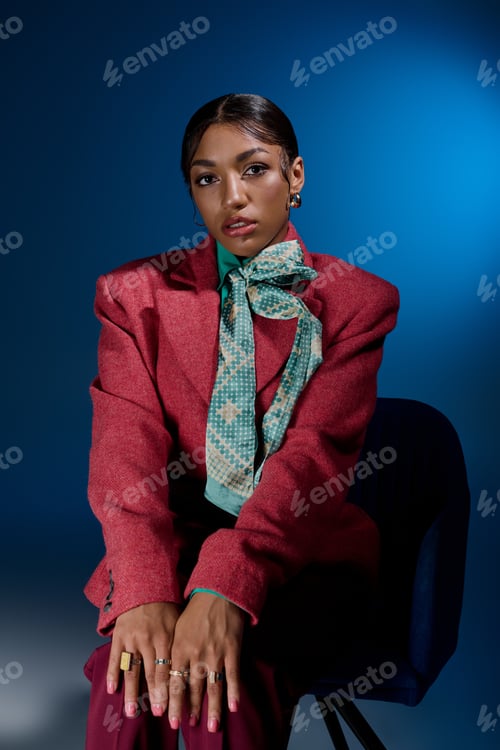 Preview: Fashionable young woman exudes confidence in stylish studio setting