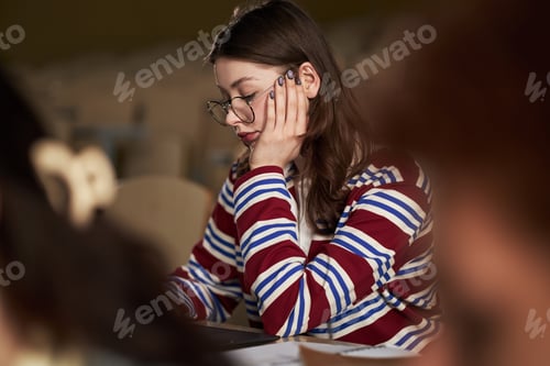 Preview: Caucasian Young Adult Woman Studying in University Classroom during Lecture