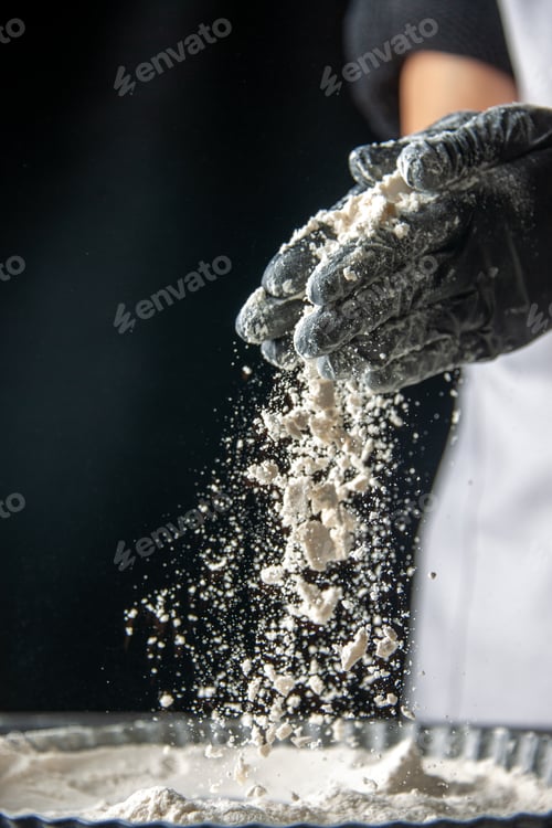Preview: front view female cook pouring white flour into the pan on dark background egg cake bakery pastry