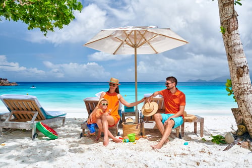 Preview: Family with three year old boy on beach. Seychelles, Mahe.