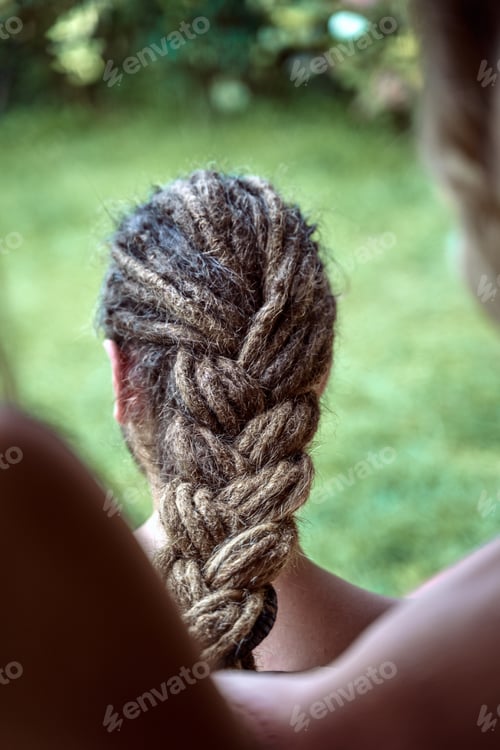 Preview: Close-up of a braid with dreadlock hair, of a man.