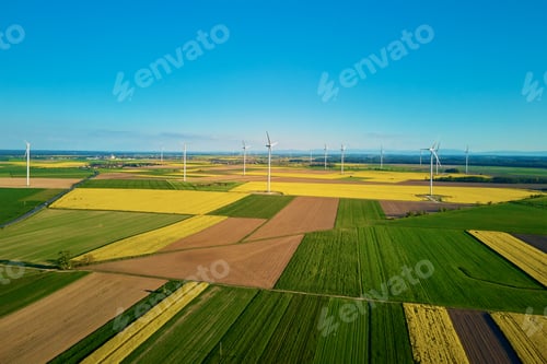 Preview: Wind Generators Over Colorful Agricultural Fields. Green energy development