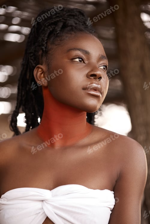 Preview: Embracing culture. Shot of a beautiful young traditional woman posing outside.